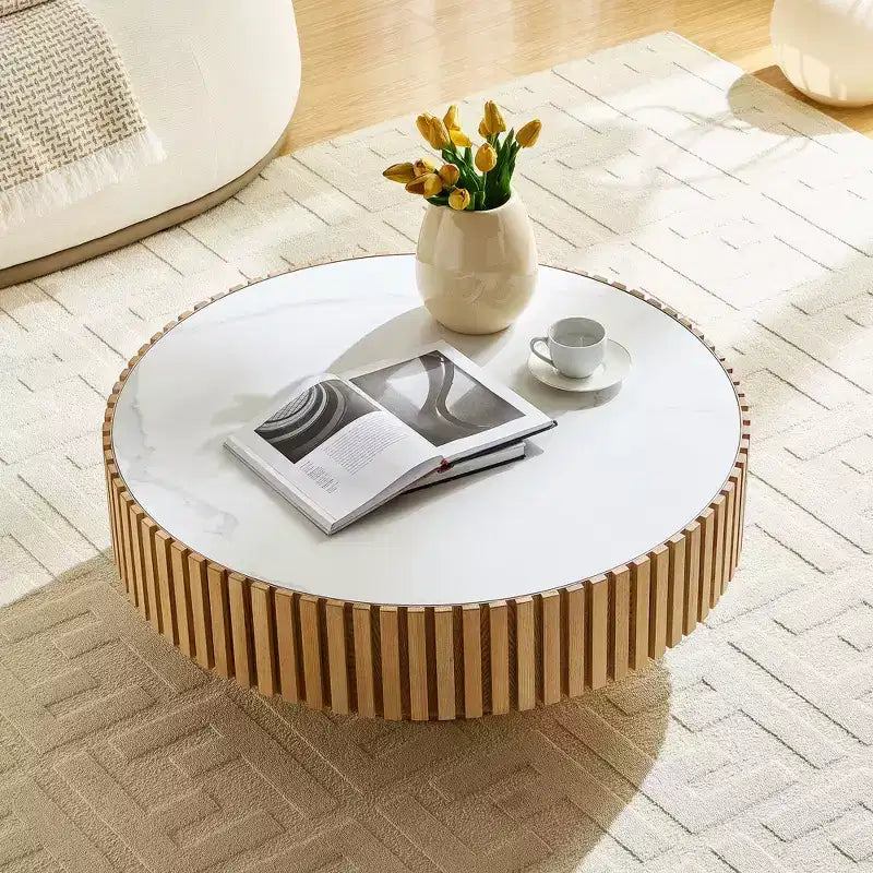 Table basse ronde moderne avec plateau en pierre frittée