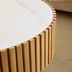 Table basse ronde moderne avec plateau en pierre frittée