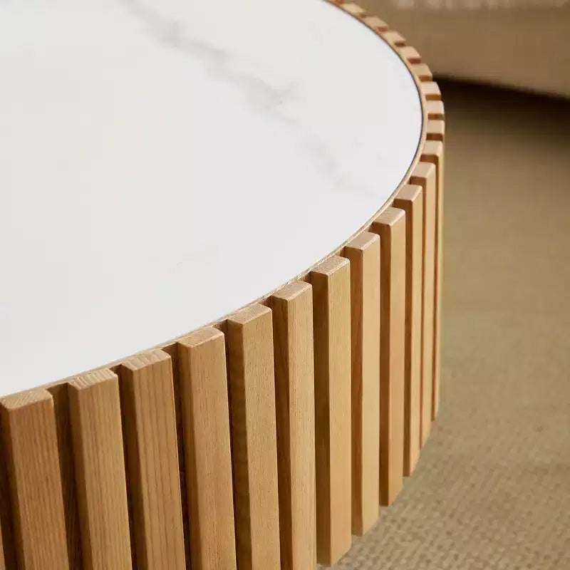 Table basse ronde moderne avec plateau en pierre frittée