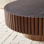 Table basse ronde moderne avec plateau en pierre frittée