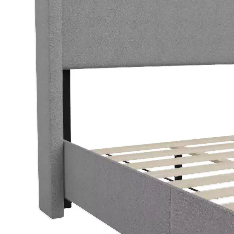 Lit plate-forme capitonné avec tête de lit à dossier ailé et coutures verticales, sommier inclus