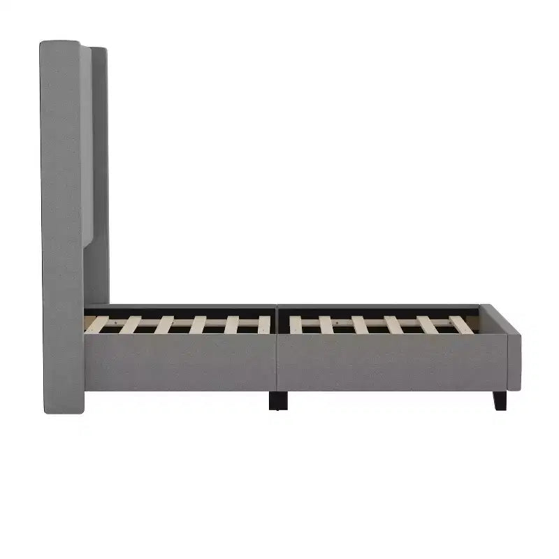 Lit plate-forme capitonné avec tête de lit à dossier ailé et coutures verticales, sommier inclus